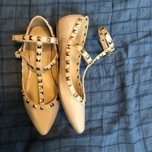 Nude studded flats.